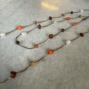 Claire’s long beaded necklace